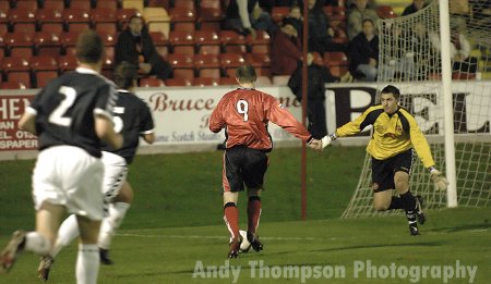 Hampshire slides the ball past the keeper for the opener.