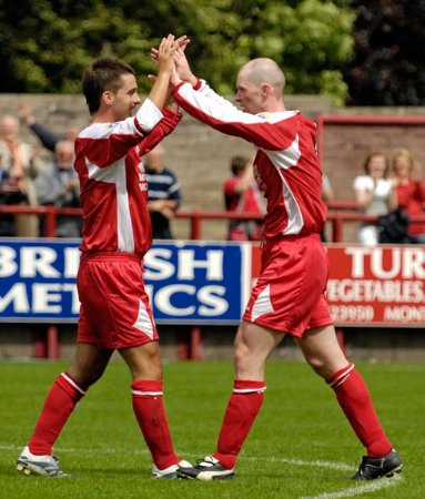 Johnston Is Congratulated By Adam Nelson